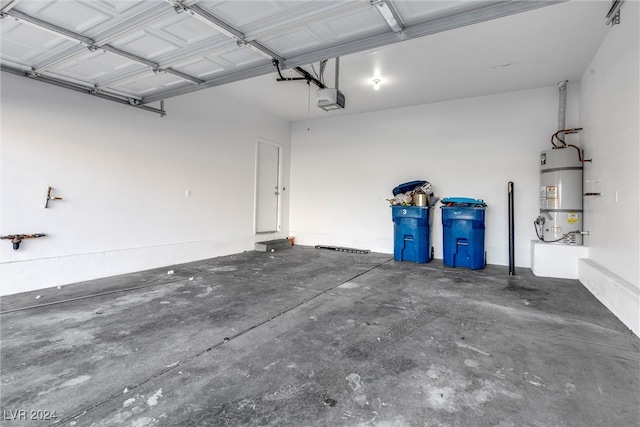 garage with secured water heater and a garage door opener