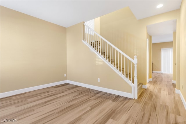 stairway featuring hardwood / wood-style floors