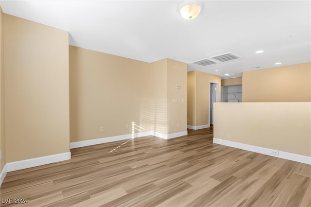 unfurnished room featuring light hardwood / wood-style flooring