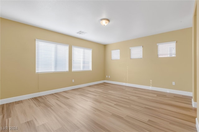 spare room with light hardwood / wood-style flooring