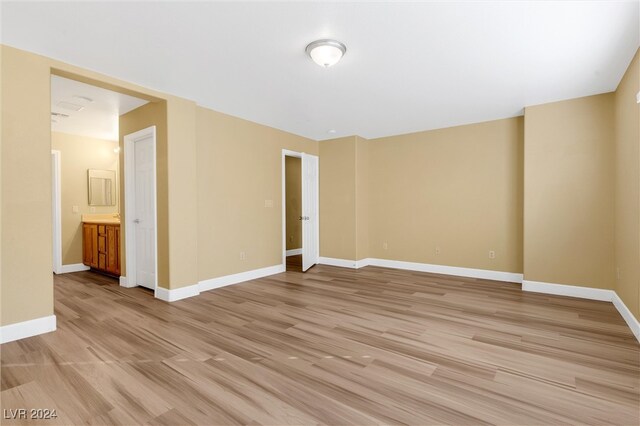 spare room with light wood-type flooring