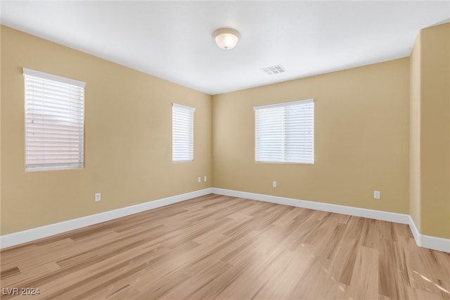 empty room with light wood-type flooring