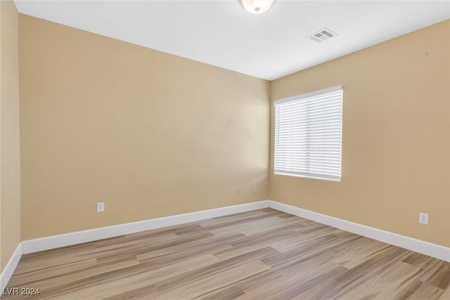 unfurnished room featuring light hardwood / wood-style floors