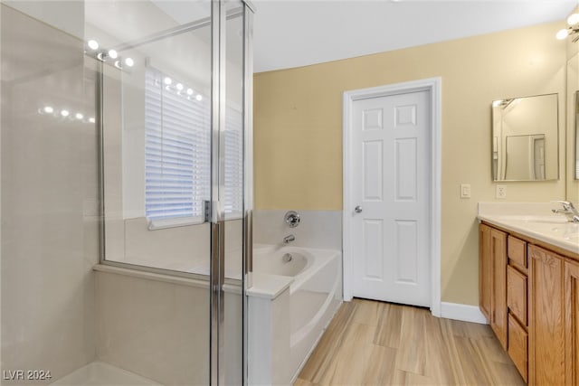 bathroom featuring vanity and a tub to relax in