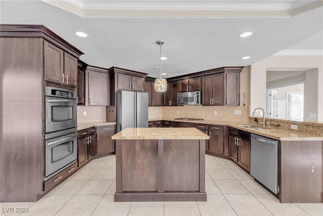 kitchen with kitchen peninsula, stainless steel appliances, hanging light fixtures, and crown molding