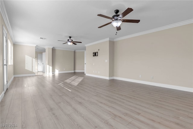 empty room with ceiling fan, ornamental molding, and light hardwood / wood-style flooring