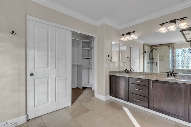 bathroom featuring tile patterned floors, crown molding, vanity, and an enclosed shower