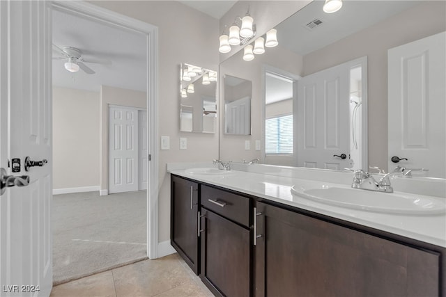 bathroom featuring vanity, ceiling fan with notable chandelier, and tile patterned flooring