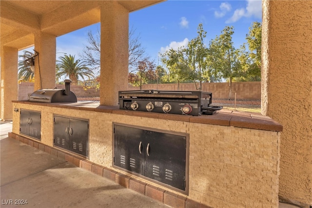 view of patio / terrace featuring area for grilling and exterior kitchen