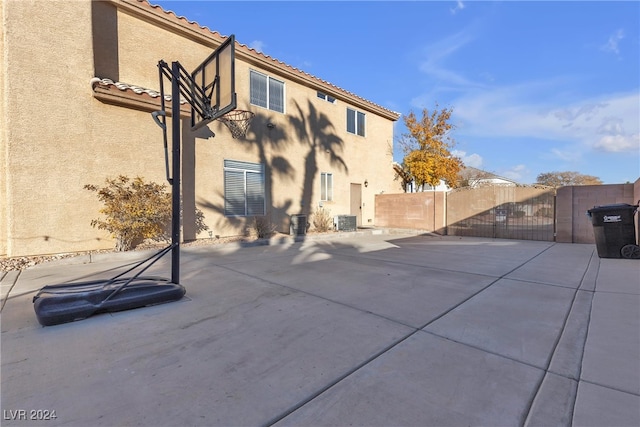 rear view of property with a patio and central air condition unit