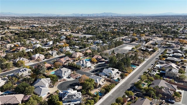 birds eye view of property with a mountain view