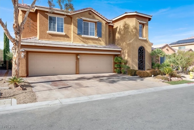 view of front of property with a garage