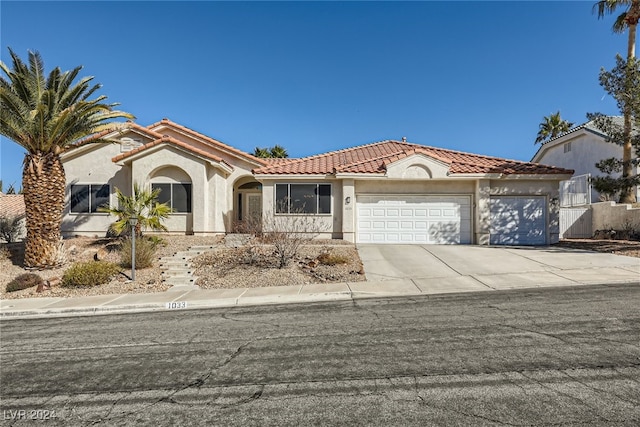 mediterranean / spanish-style home featuring a garage