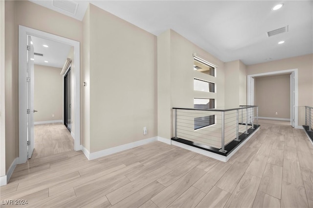 hallway featuring light hardwood / wood-style flooring