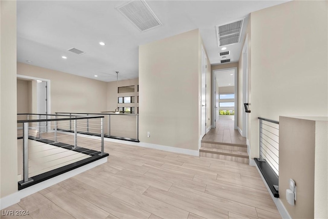 corridor featuring light hardwood / wood-style floors