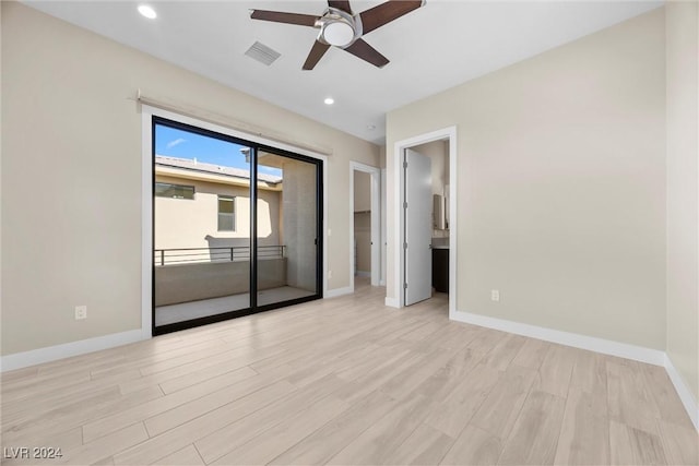 empty room featuring ceiling fan and light wood-type flooring