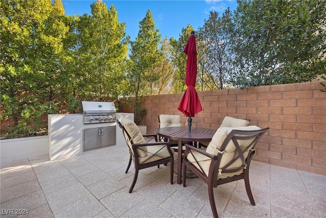 view of patio featuring grilling area and exterior kitchen