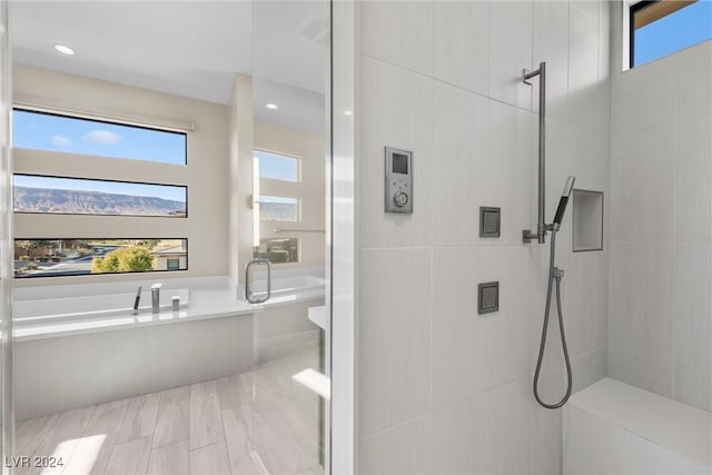 bathroom featuring plus walk in shower