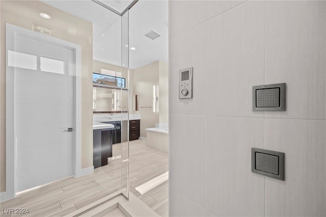 bathroom featuring vanity and wood-type flooring