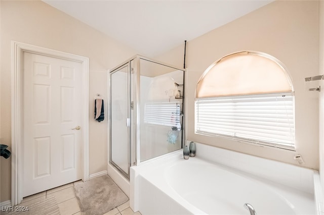 bathroom with tile patterned floors and separate shower and tub