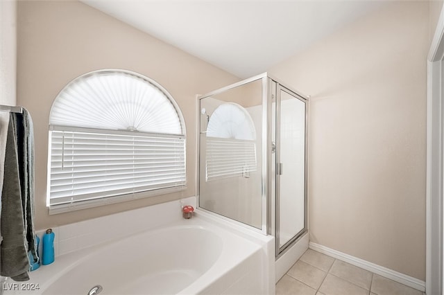 bathroom featuring tile patterned flooring and separate shower and tub