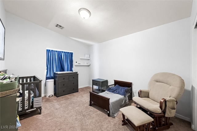 carpeted bedroom featuring vaulted ceiling