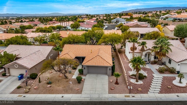 birds eye view of property featuring a mountain view