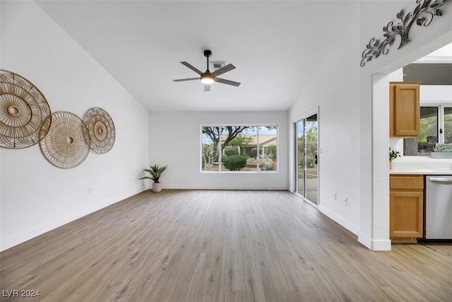 unfurnished living room with light hardwood / wood-style flooring, ceiling fan, and lofted ceiling