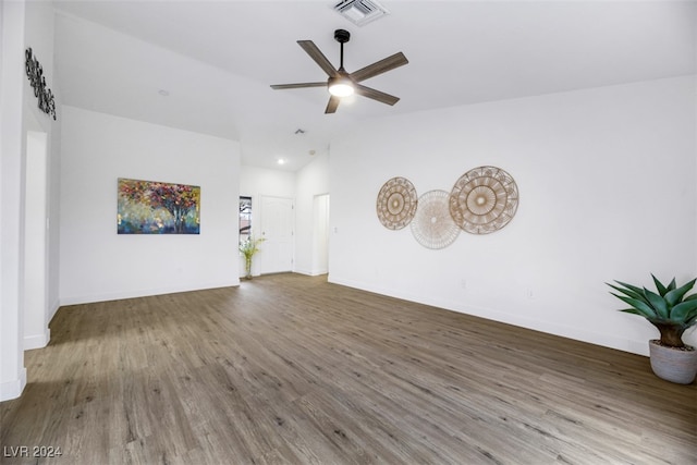 unfurnished living room with ceiling fan, wood-type flooring, and lofted ceiling