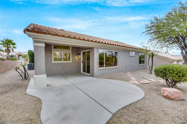 back of property featuring a patio area and central AC unit