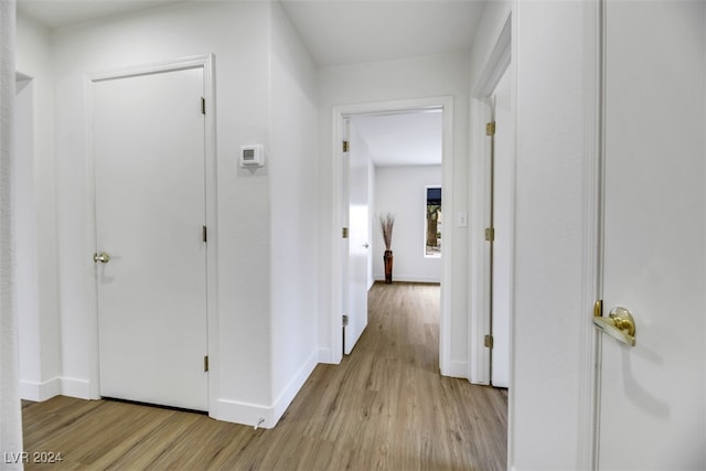 corridor featuring light hardwood / wood-style floors