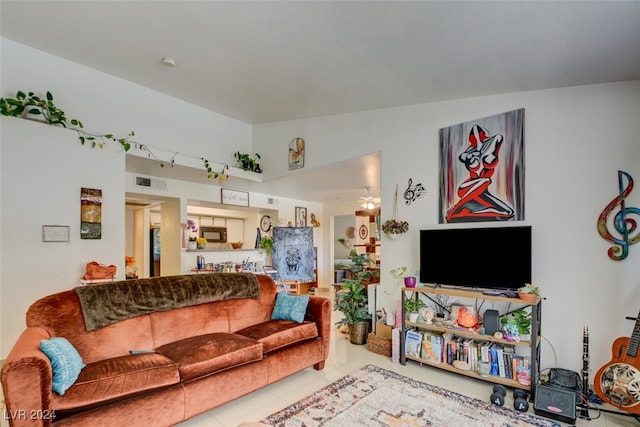 tiled living room featuring vaulted ceiling