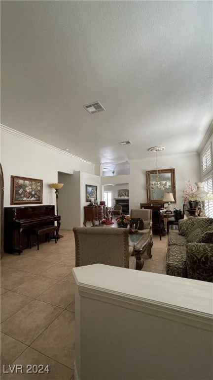 tiled living room featuring crown molding and a textured ceiling