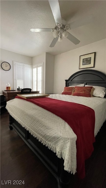 bedroom with a textured ceiling and ceiling fan