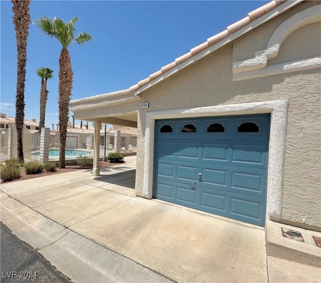 garage featuring a community pool