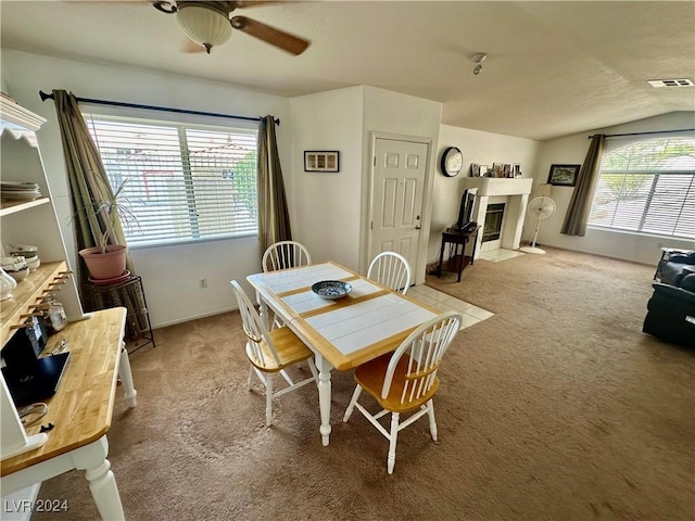 2153 Camel Mesa Dr, Laughlin, NV 89029 - dining space featuring carpet, ceiling fan, a fireplace with flush hearth, and lofted ceiling