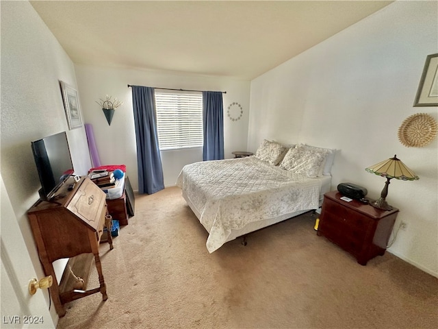 bedroom with light carpet