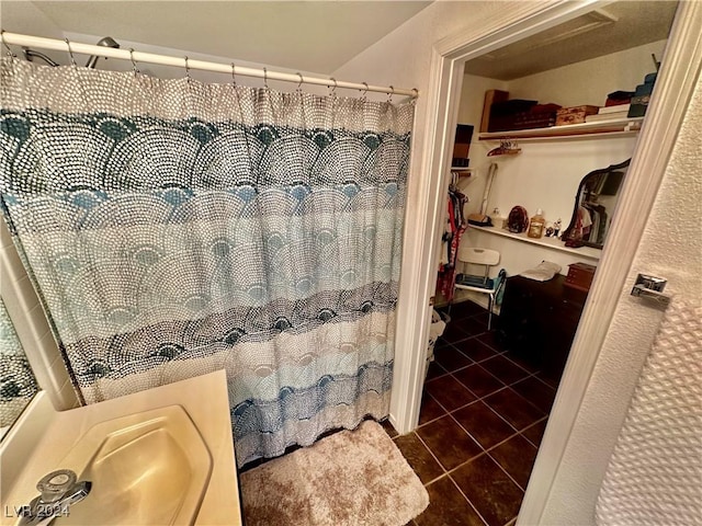 2153 Camel Mesa Dr, Laughlin, NV 89029 - full bathroom with tile patterned floors, a walk in closet, and a shower with shower curtain
