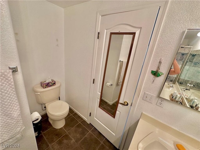 2153 Camel Mesa Dr, Laughlin, NV 89029 - bathroom with tile patterned flooring, a textured wall, a shower, and vanity