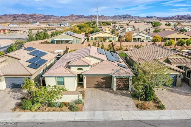 birds eye view of property with a mountain view