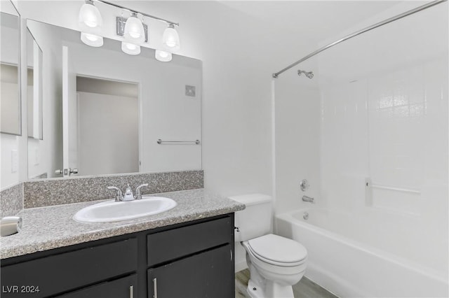 full bathroom with shower / bathtub combination, vanity, and toilet