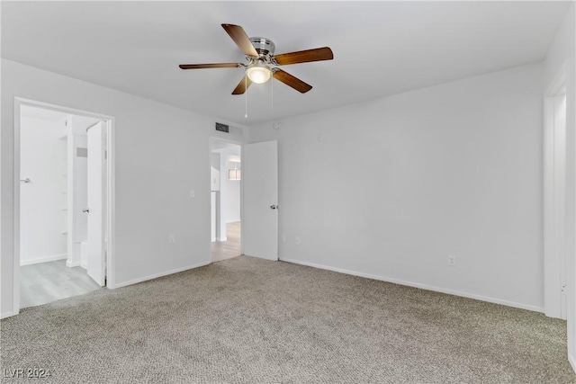 carpeted empty room with ceiling fan