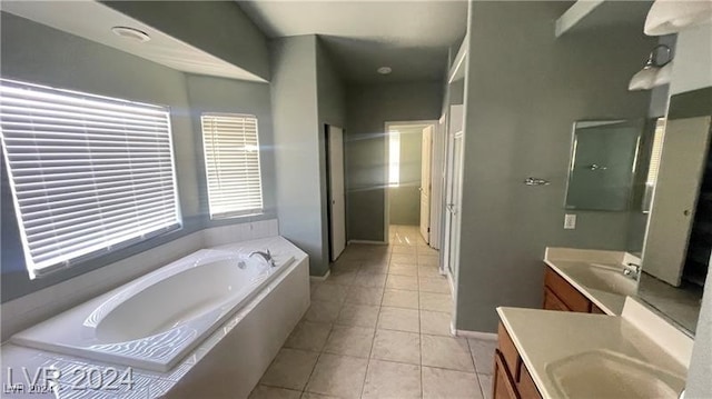 bathroom featuring tile patterned floors, vanity, and separate shower and tub