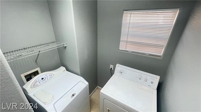 laundry area featuring washing machine and clothes dryer