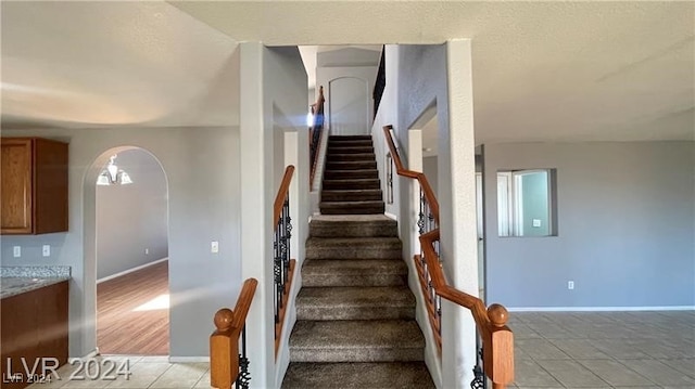 staircase with wood-type flooring