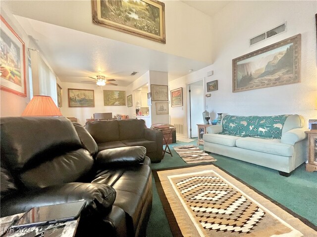 living room featuring carpet flooring and ceiling fan