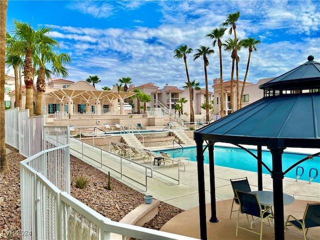 view of swimming pool featuring a gazebo and a patio