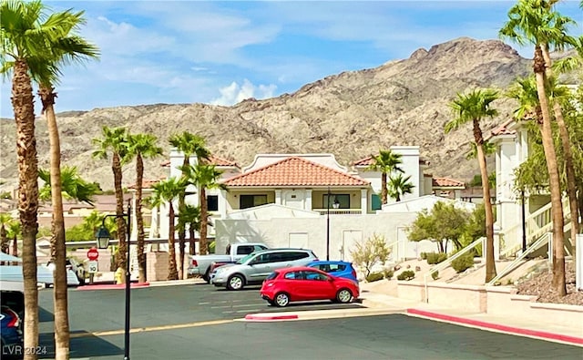 view of vehicle parking with a mountain view