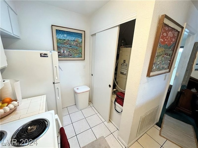 bathroom with tile patterned floors