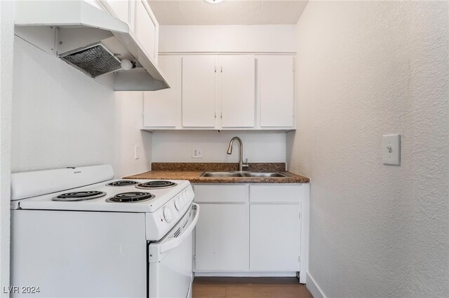 kitchen with white cabinetry, white electric range, and sink